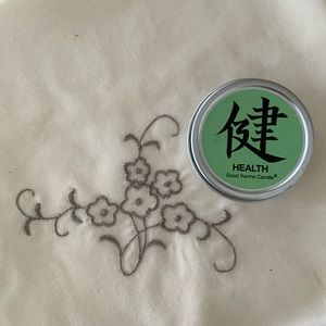 Good Karma Candle Company “Health” travel size candle in a tin